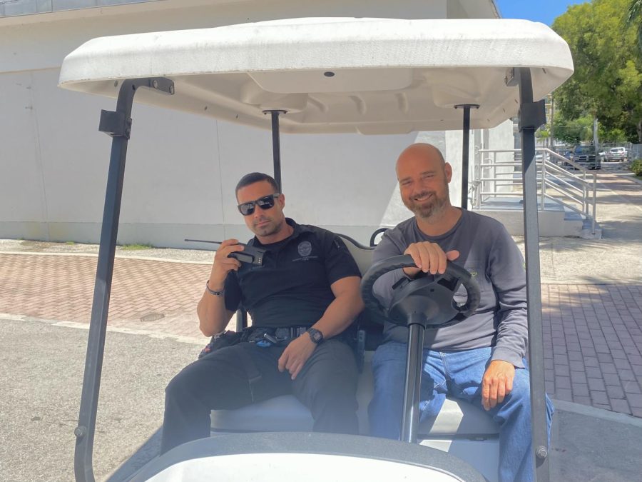 Officer Suarez and Ricky G. on their daily golf cart expedition.