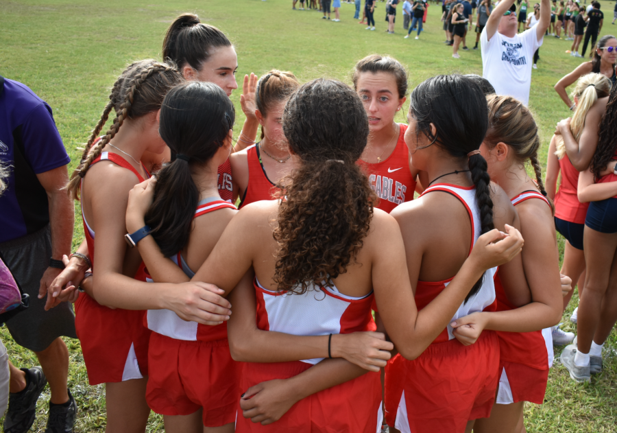 The girls team stands together as they encourage each other for what is up ahead. 