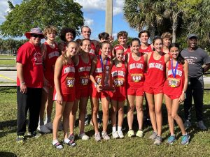 Proud athletes and coaches get their picture taken after learning they would advance to states.