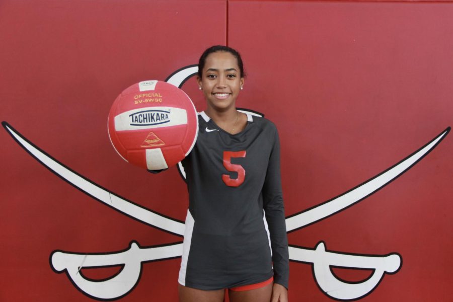 Senior Avery Felix proudly holds her Senior Night game ball as team captain. 