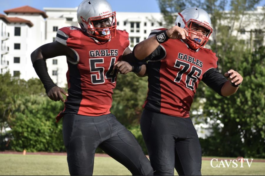 Senior Reynaldo Gimenez (right) celebrates with his teammate after a play during a game against Miami Coral Park Senior High.