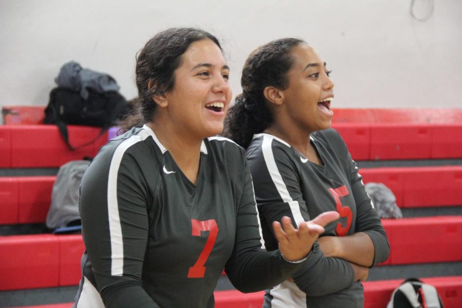 Veterans on the court, Julie Maldonado (left) and Avery Felix (right) lift their teammates from the sidelines.