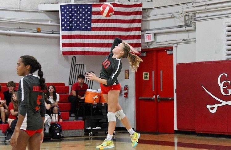 Freshman Corina McDanal delivers a powerful serve in a matchup Miami Beach High School.