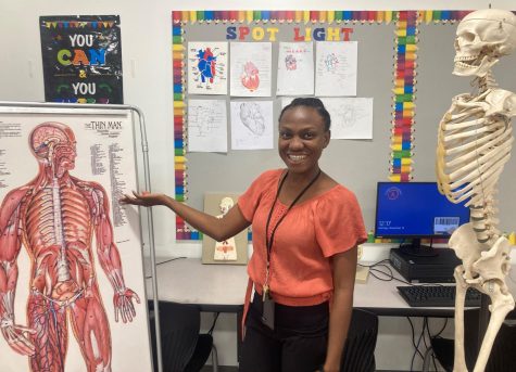 Rookie teacher Ms. Anger, smiles beside her favorite people, Edward (skeleton on right) and the Thin Man (left). 