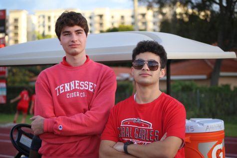 Junior varsity co-coaches Ethan Kaddour-Moore and David “DAK” Kuper, pose beside the football field, prepared for another days practice. 