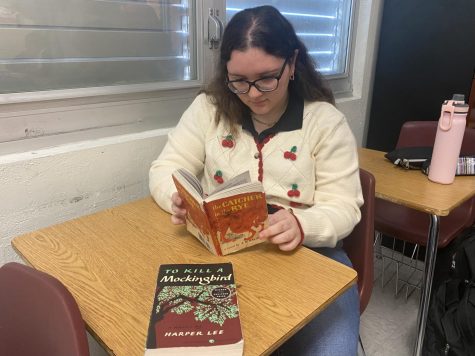 Michelle Hernandez reads Catcher in the Rye, a controversial book that has been added  to the Banned Books list.