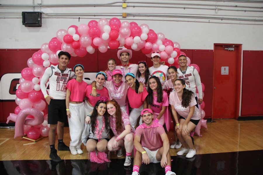 The Class of 2023 take a quick photo to celebrate their last pink pep rally.