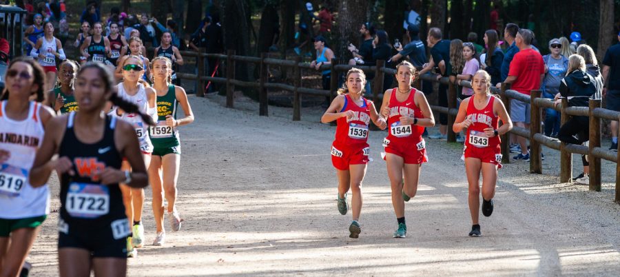 Junior Veronica Montalvo (leftmost) paces with seniors Adriana Torras (middle) and Audrey Simon (rightmost) at the FHSAA 4A race.