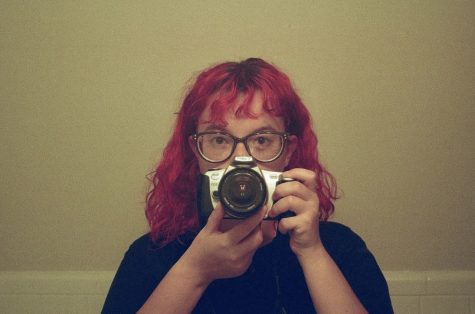 Taking pictures as a hobby, Whalen experiments with her film camera, always being behind the lens.