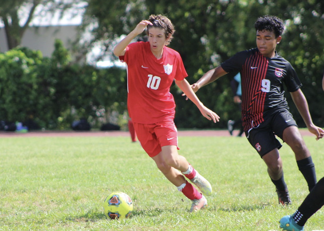 Freshman Gabriel Carrizo determined to keep possession of the ball during the Gables v. South Ridge soccer game. 