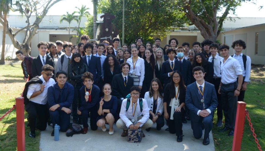 FBLA+participants+showcased+their+medals+after+receiving+multiple+accolades.+