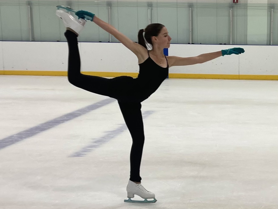 Adelaide Schoeni holds a firm position during her ice skating lesson.