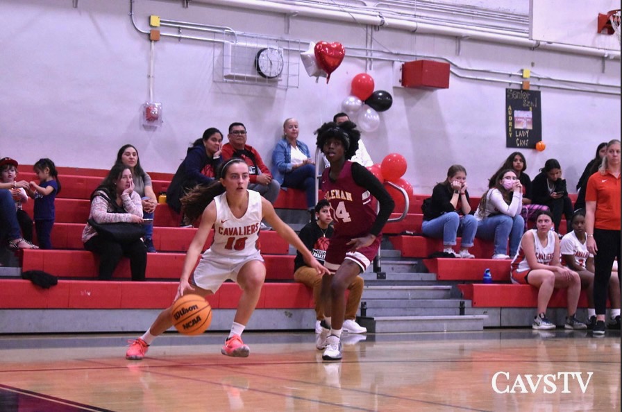 Senior Isabella Morales sprints with the basketball to attempt a layup.