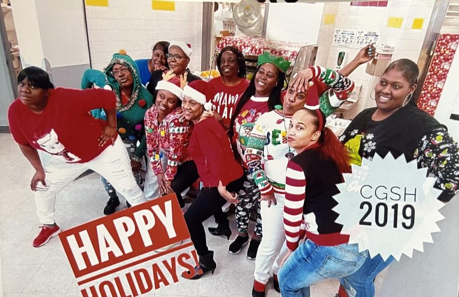 Always full of spirit, cafeteria workers  such as Hodges (santa hat, back row) took to celebrate the holiday spirit by taking a group picture.