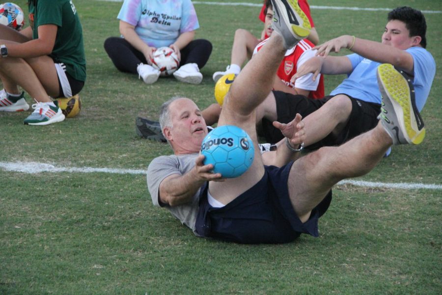 Before individuals started scoring goals, Mr. Paz showed his crowd how to revolve the ball around the legs.