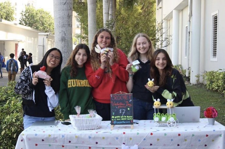 Savages friends gathered around the Valentines Gram sales table to help promote her organization. 