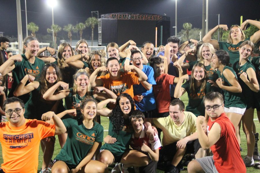 With a successful first winter clinic on UM Cobb Stadium, many of the UMs womens soccer team posed with Down syndrome individuals on joining the clinic.