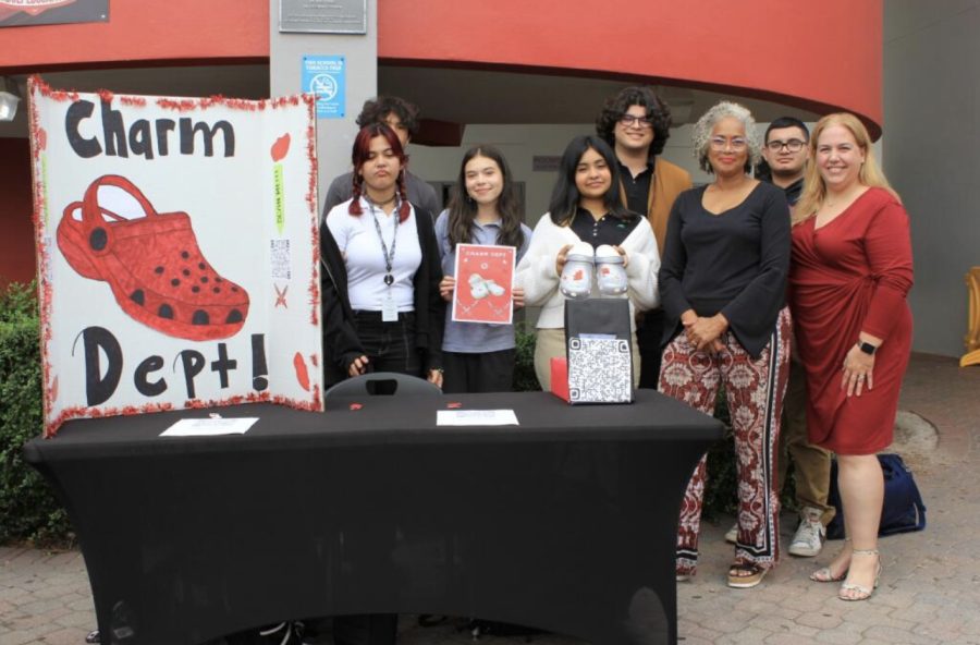 Selling their Cavalier Croc Charms in front of the 9000-building, the Charm Dept. is prepared to tackle their JA Company Program throughout spring.