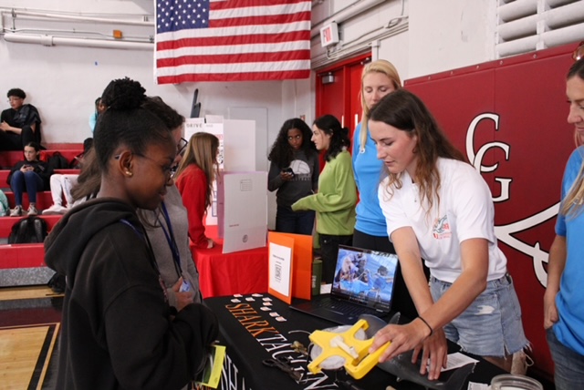 Students walk up to local organizations tables.