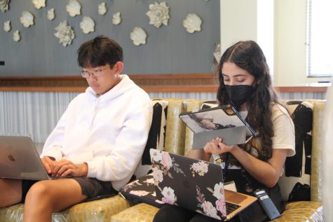Newspaper journalist Caden Liu and Lia Garibay from Trinity Preparatory School work behind the scenes in their comfiest clothes. Working on a quick-turn drawing challenge, the muted color of their clothes contrasts the vibrant colors on their screen.