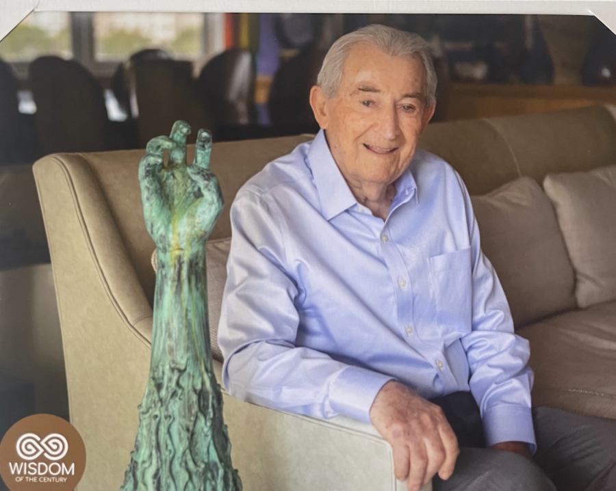 Holocaust survivor David Schaecter with a model of the Holocaust Memorial in Miami Beach, whose creation he was a part of.