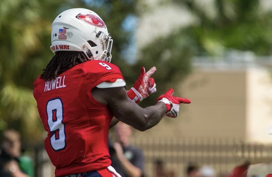 Putting up his famous finger guns, Howell celebrates his teams point as they head toward yet another victory.