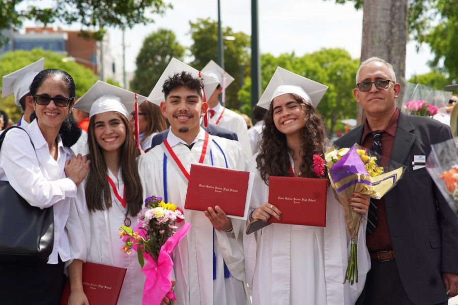 Following the ceremony, the graduating class exits the Watsco Center, commemorating their last moment as seniors. As they begin their next chapter, they continue to hold the ones they love close.