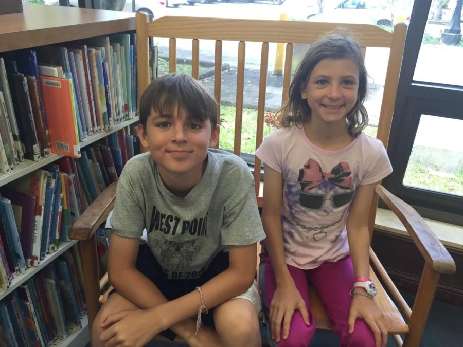 Smiling inside the Coral Gables Library, the Weckel twins have shared a close bond all their lives. Robert (left) will attend Santa Fe College while Christina (right) travels to Central Florida this fall. 