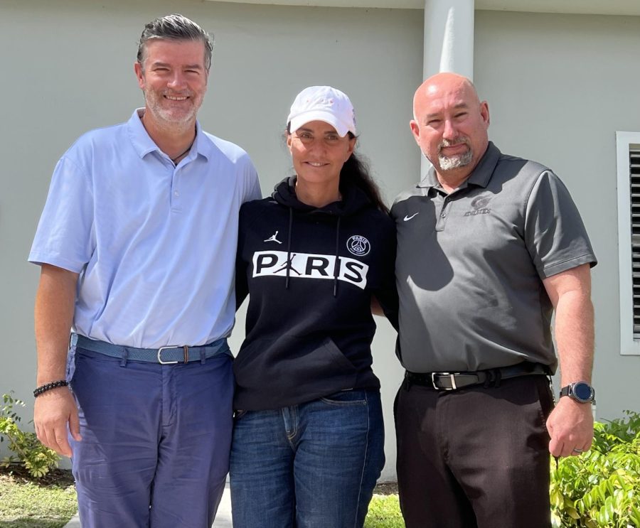After many years of facilitating meetings, PSG Academy representatives Richard (left) and Roux pose with Gables’ athletic director, Mr. Romero (right), in closing the deal.