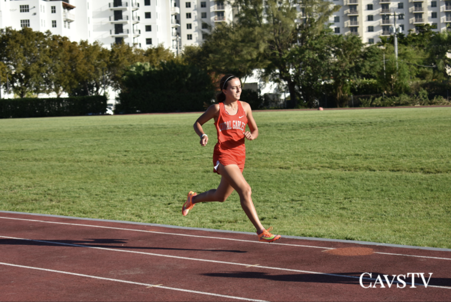 Senior Isabella Morales dashes to the finish line at the end of the 1,600m race on Feb. 22