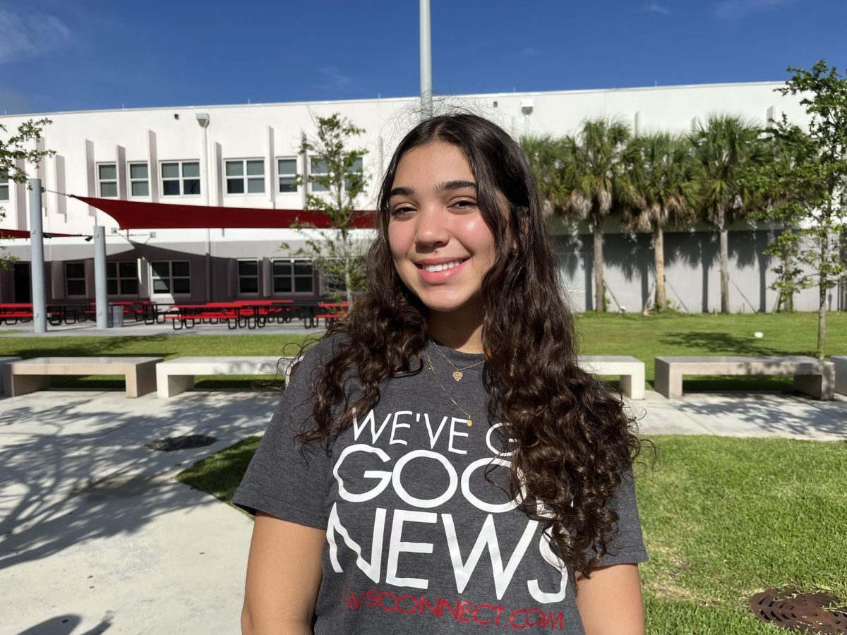 Junior Barbarav Teixeria smiles as she takes her staff photo. It is her second year in the publication fdghucidf