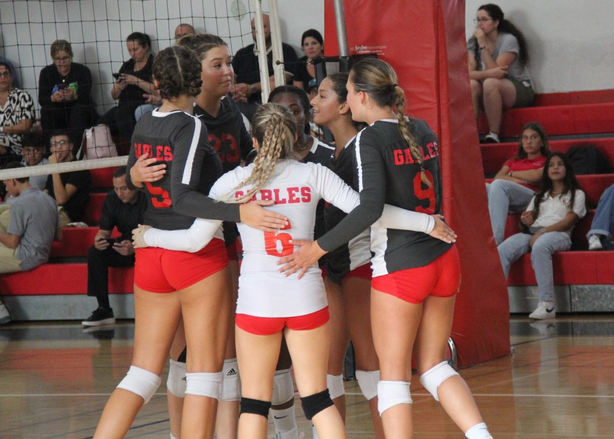 Joining forces after a point, the girls reassure each other about the next play. 