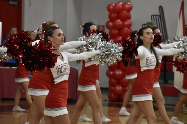 As the crowd came piling in, cheerleaders greeted the Cavaliers dressed in red.