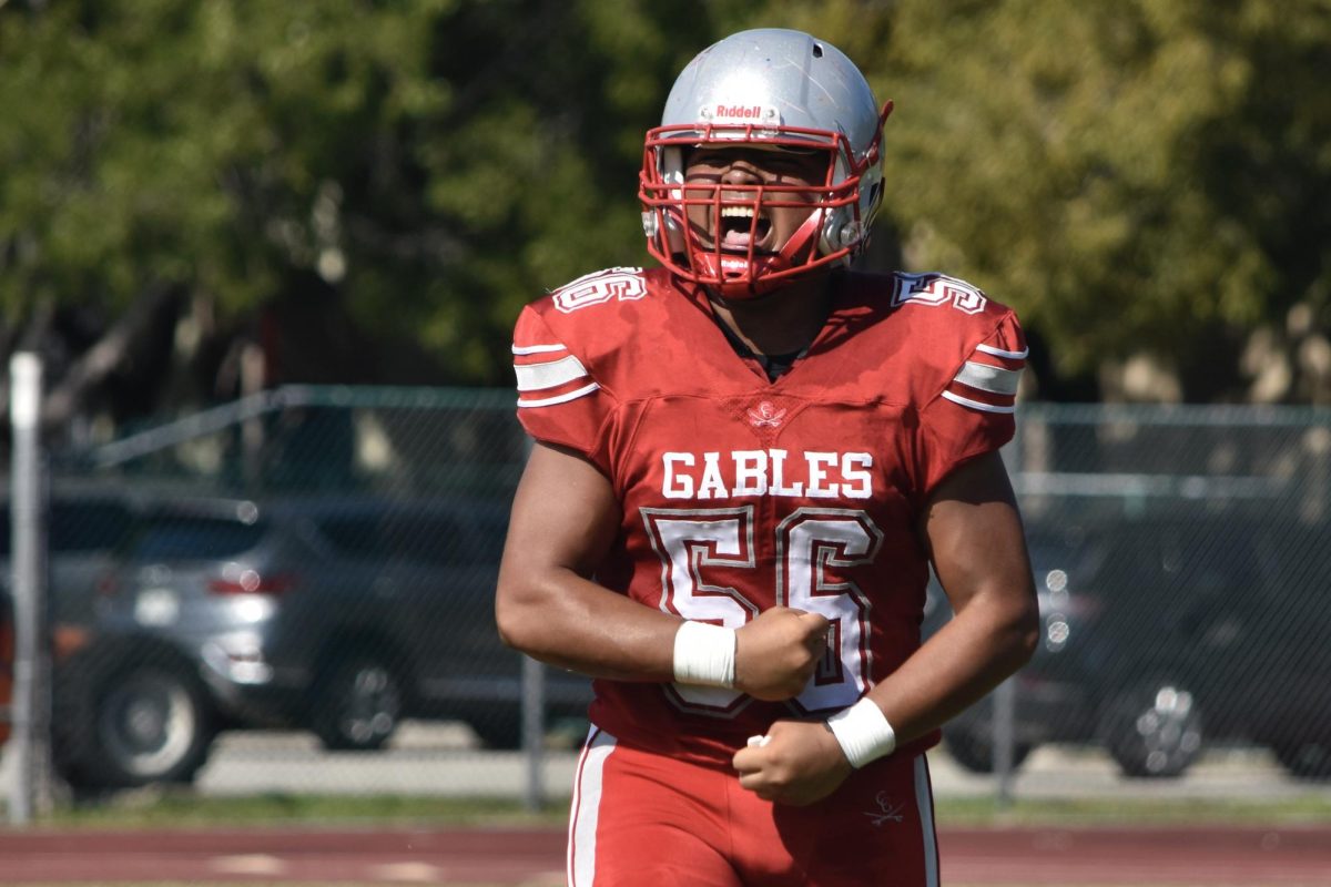 Angel Obando celebrates his teams victory against the South Miami Cobras, ending with a score of 36 to 6.