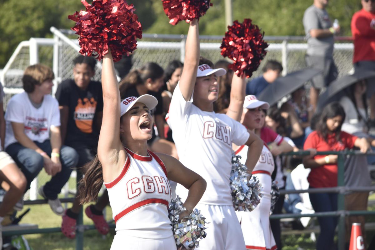 Co-Captain Carolina Martinez cheers on the football team as they defeated the South Miami Cobras.