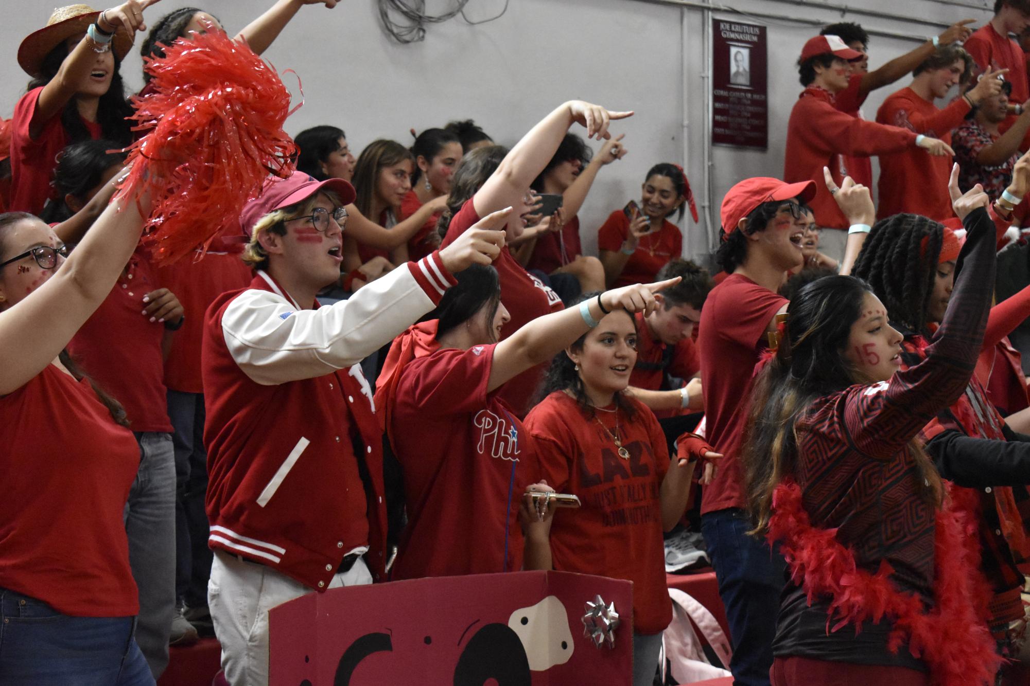 After an hour of fun, music and games, Cavaliers end the pep rally pointing to the lyrics, singing Gables' Alma Mater. 