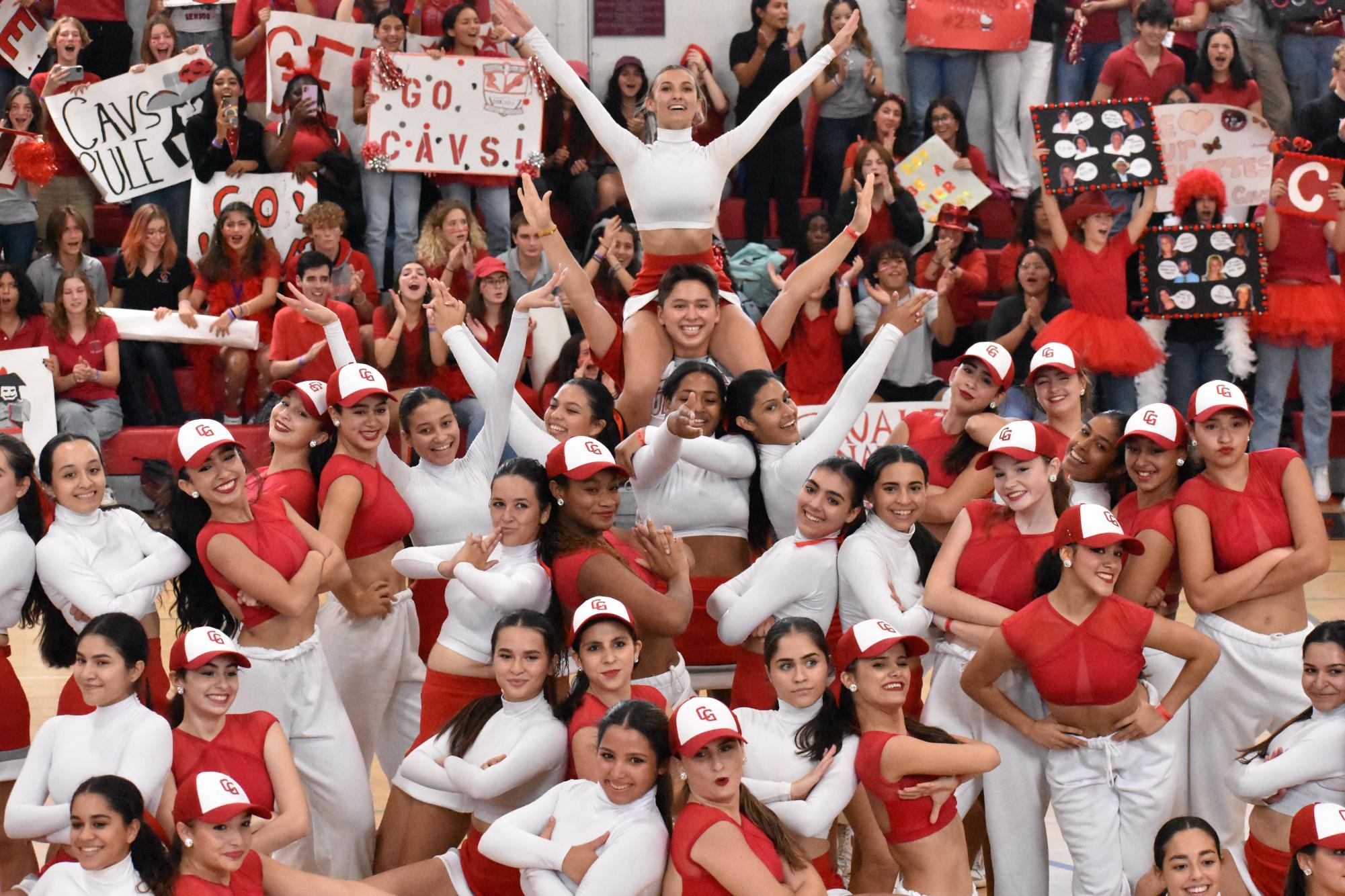 Posing for a final picture after a sensational performance, the Gablettes and cheerleaders join in front of cheering crowd. 