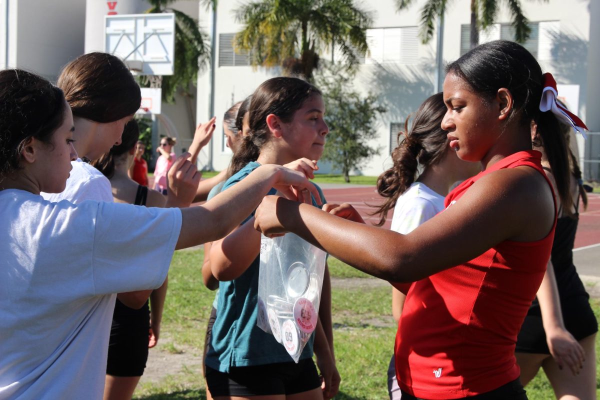 Helping out in last year’s cheerleading tryouts, co-captain Guzman exemplifies the definition of being a big sister, by helping her fellow candidates.