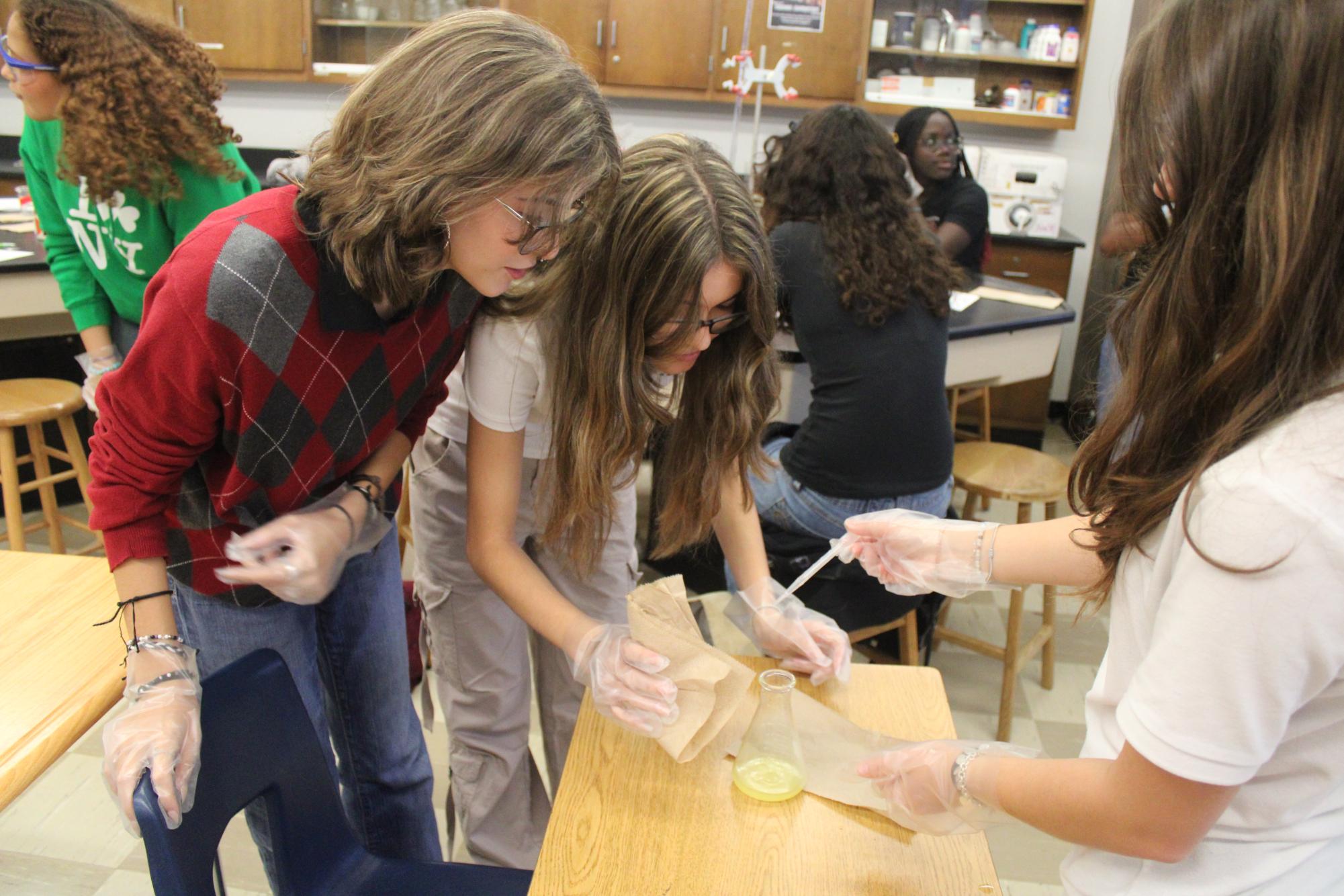 IB Chemistry Students Work to Neutralize Tablets with Hydrochloric Acid
