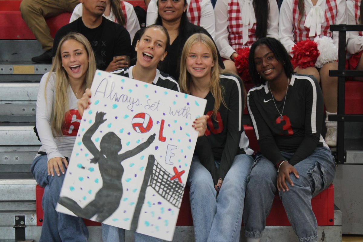 Volleyball players came out to support Lex as she received the award, cheering her on.