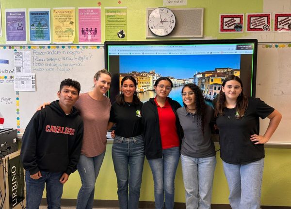 In their first meeting of the school year, the Italian Club board and their sponsor, Mrs. Chase, celebrate the successful end to the afternoon. They continue to look forward to many more eventful meetings throughout the school year.