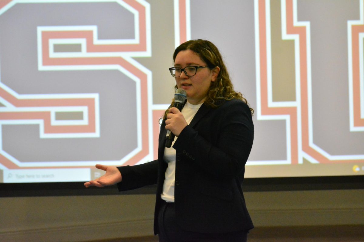 Giving a presentation, junior Michelle Hernandez aims to bring people of different backgrounds together through Elia Tases Hope.