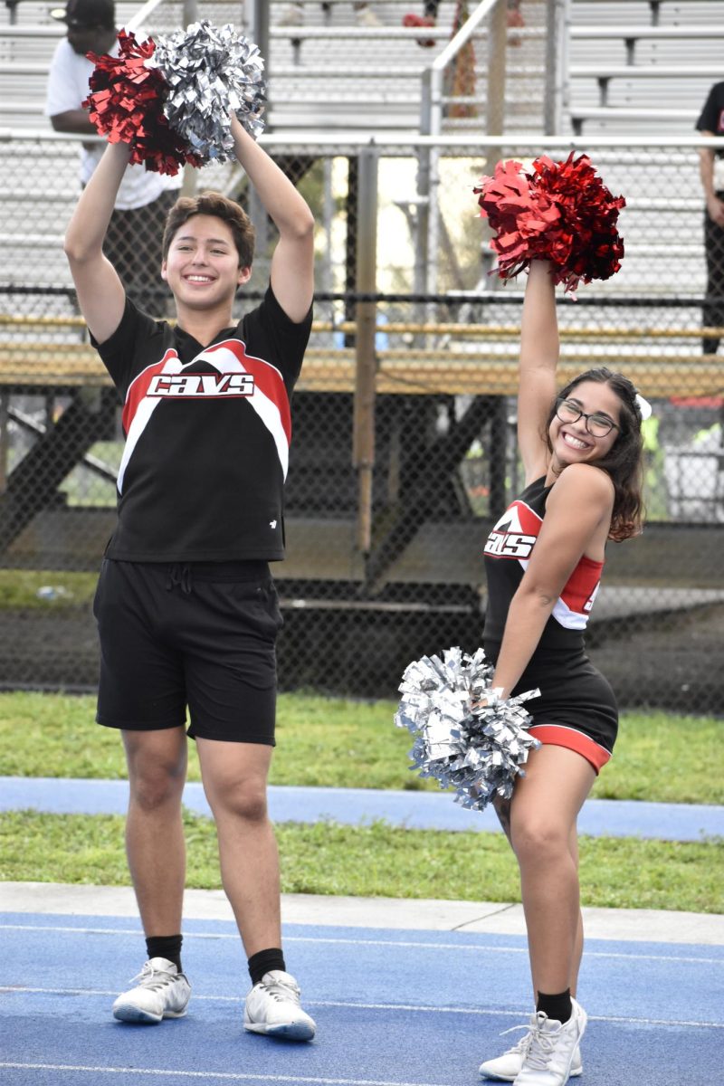 Sophia Daly showing off her spirit next to one of her teammates during the Miami High v. Coral Gables game