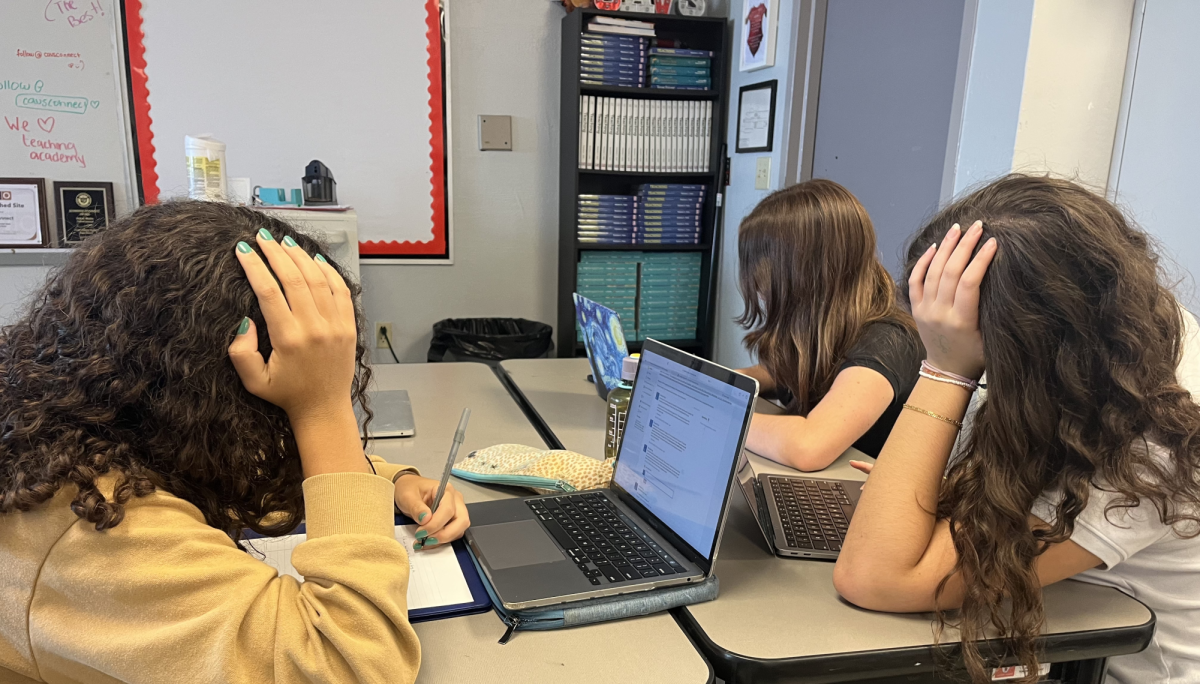 Sophomores Yara Korse, Barbara Teixeira and Irela Montelongo stress over their upcoming exams. They are overwhelmed by their PSAT and FAST tests.