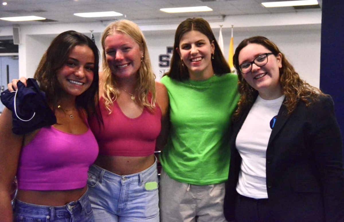 Visting St. Thomas University on Aug. 26, 2023, Hernandez poses with college students interested in joining the non-profit.