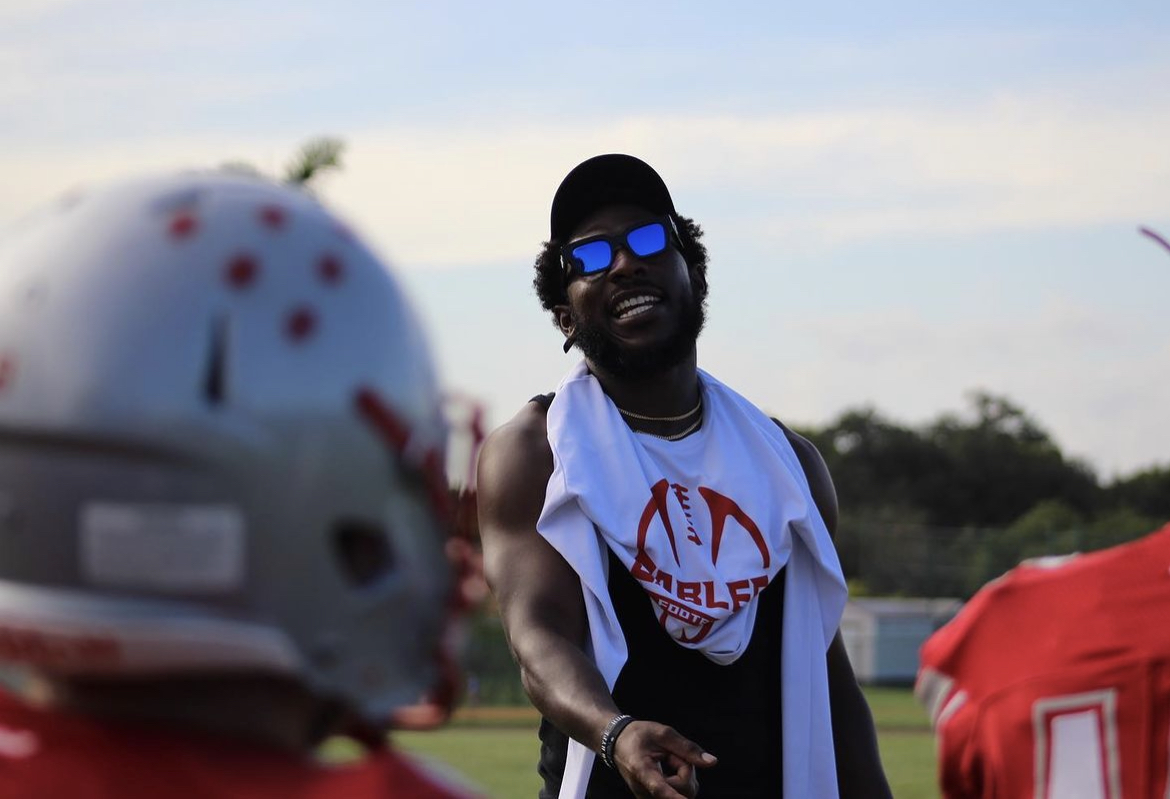 Training every football practice, Buddy gives the Gables team a pep talk on tactics and maneuvering.