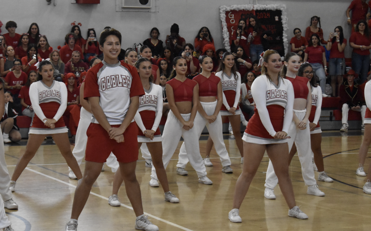 Gablettes and cheerleaders pose as one  large team during their performance at the first pep rally of the 2023-2024 school year.