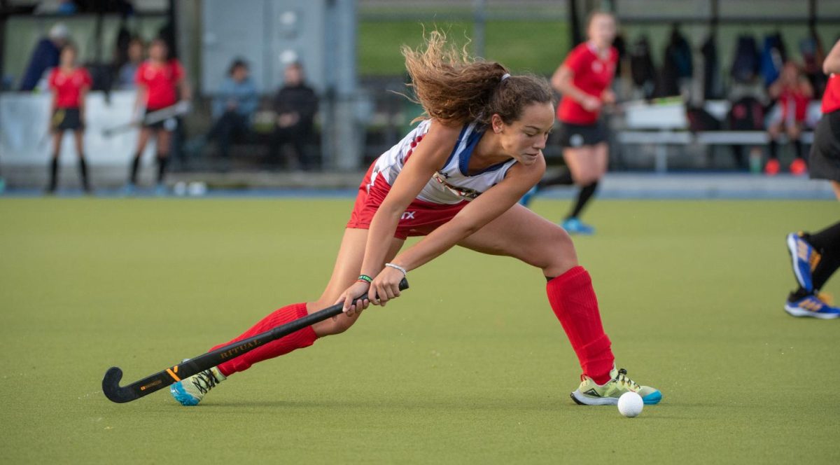 Quinteros "sweeps" the ball during her field hockey game. She will continue to expand her field hockey profile at the University of Virginia