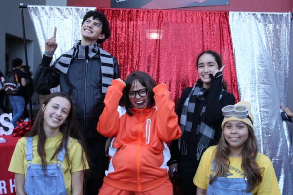 On Day 1 of Spirit Week, themed Superheroes vs. Villains, students attended school as Gru, minions and Vector. At the photo booth, they showed off their unique costumes. 