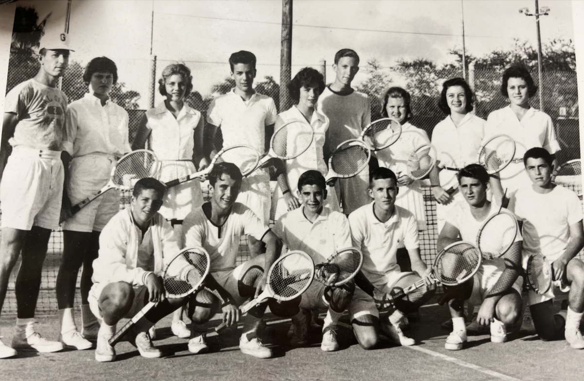 Mr. Finora stands next to his team (first one on the left). He coached tennis for two years and also plays tennis himself.
